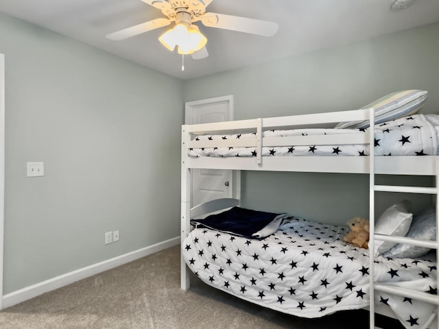 carpeted bedroom with baseboards and ceiling fan