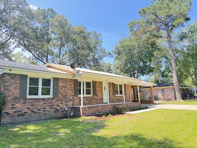 449 Estates Dr, Walterboro, SC 29488 - view of front of house with driveway, a front lawn, crawl space, a porch, and brick siding