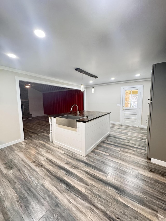 449 Estates Dr, Walterboro, SC 29488 - kitchen with dark countertops, ornamental molding, wood finished floors, recessed lighting, and pendant lighting