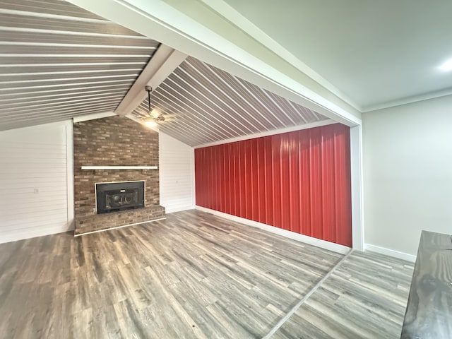 449 Estates Dr, Walterboro, SC 29488 - unfurnished living room with wood finished floors, wood walls, and a fireplace