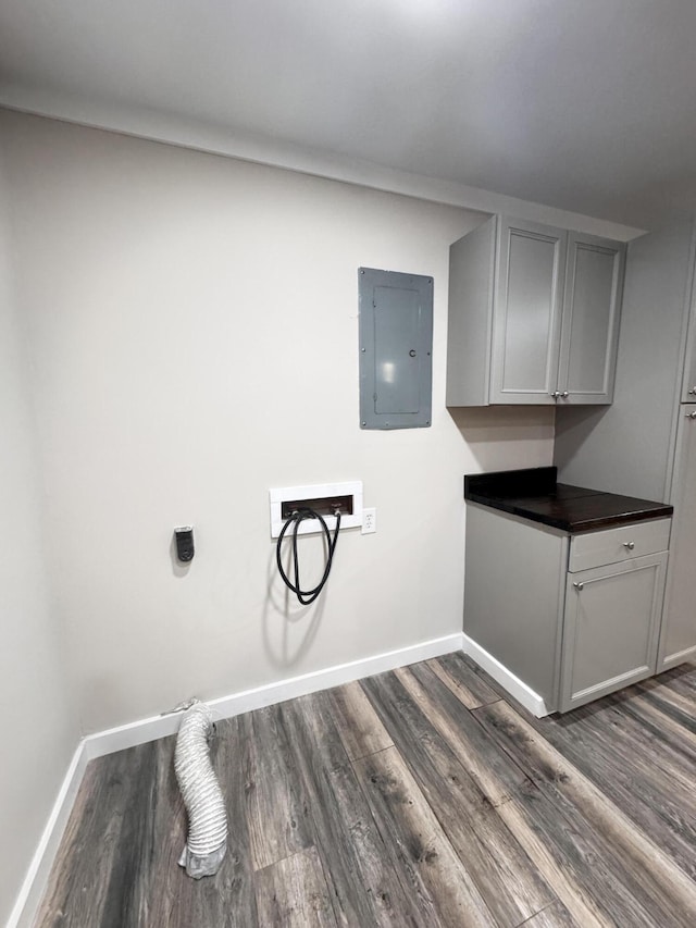 449 Estates Dr, Walterboro, SC 29488 - laundry room featuring electric panel, hookup for a washing machine, dark wood-style flooring, cabinet space, and electric dryer hookup