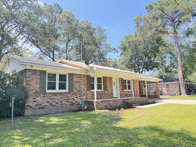 449 Estates Dr, Walterboro, SC 29488 - view of front of house featuring a front lawn, covered porch, crawl space, a metal roof, and brick siding