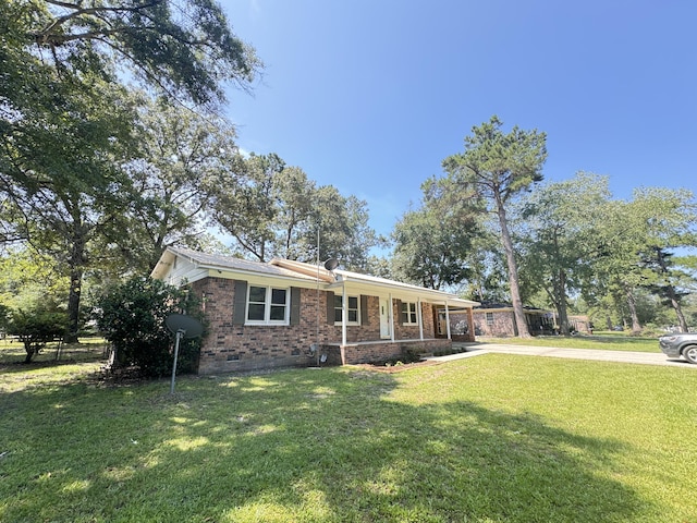 449 Estates Dr, Walterboro, SC 29488 - ranch-style house featuring a porch, concrete driveway, brick siding, a front lawn, and crawl space