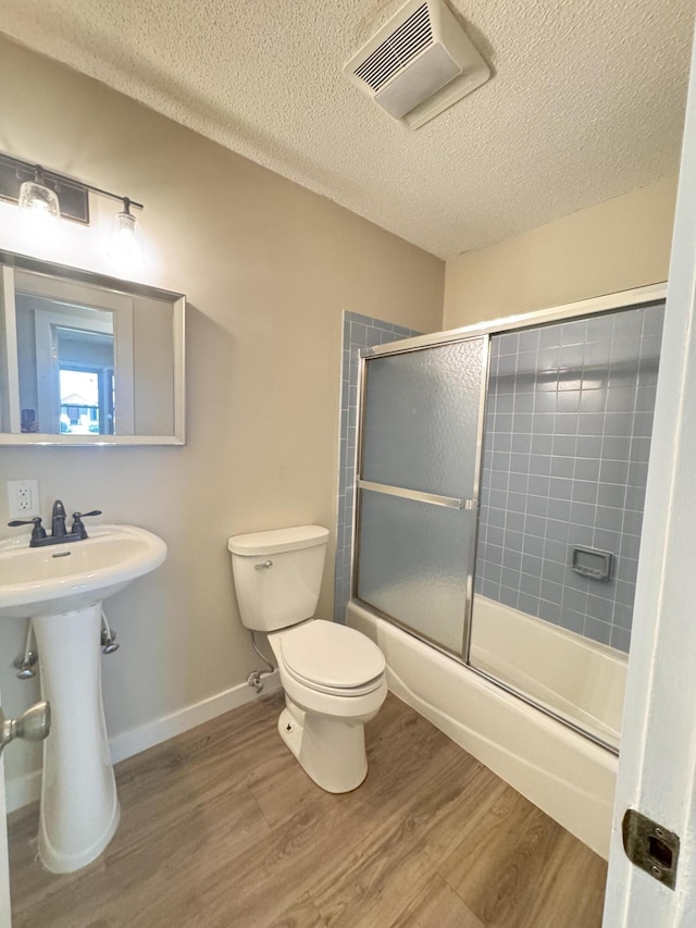 449 Estates Dr, Walterboro, SC 29488 - full bath featuring wood finished floors, enclosed tub / shower combo, and a textured ceiling
