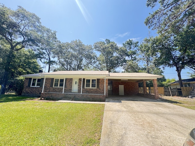 449 Estates Dr, Walterboro, SC 29488 - ranch-style home featuring concrete driveway, brick siding, and an attached carport