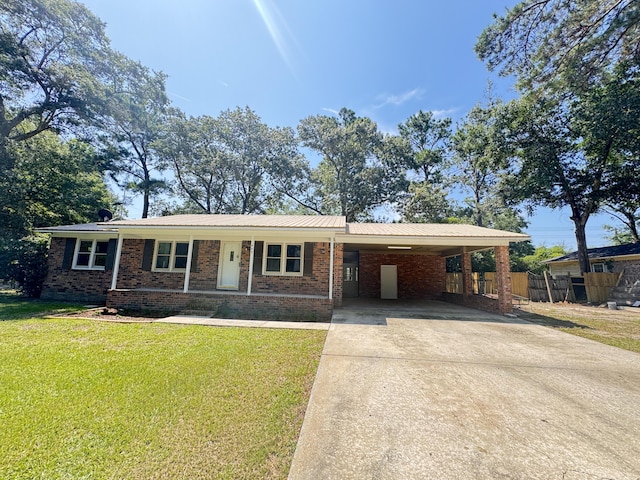 449 Estates Dr, Walterboro, SC 29488 - ranch-style house with driveway, an attached carport, brick siding, a porch, and a metal roof