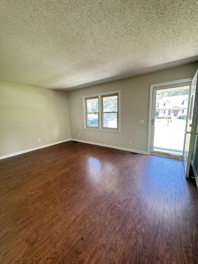 449 Estates Dr, Walterboro, SC 29488 - empty room with a textured ceiling and dark wood-type flooring