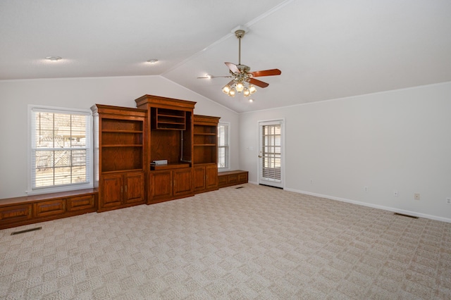 unfurnished living room featuring visible vents, carpet floors, baseboards, and vaulted ceiling