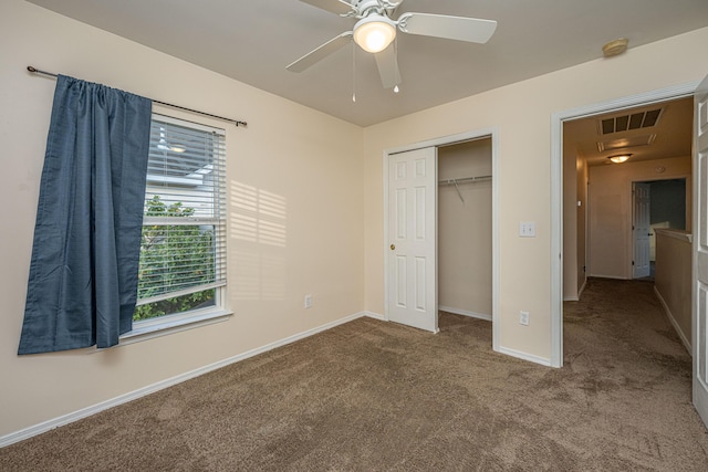 unfurnished bedroom with visible vents, baseboards, carpet floors, a closet, and a ceiling fan