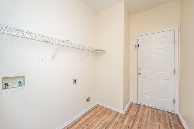 laundry room featuring baseboards, laundry area, hookup for a washing machine, light wood-style flooring, and electric dryer hookup