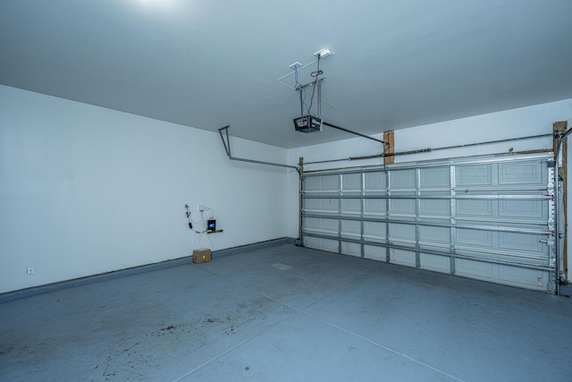 garage featuring baseboards and a garage door opener