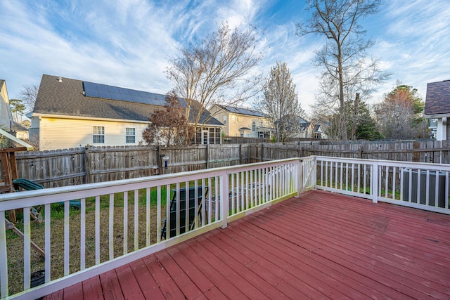 deck featuring a residential view and a fenced backyard