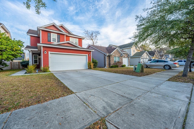 view of front facade with concrete driveway, an attached garage, fence, and a front lawn