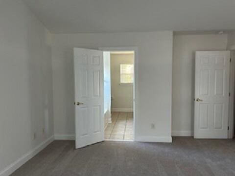 unfurnished bedroom featuring carpet flooring