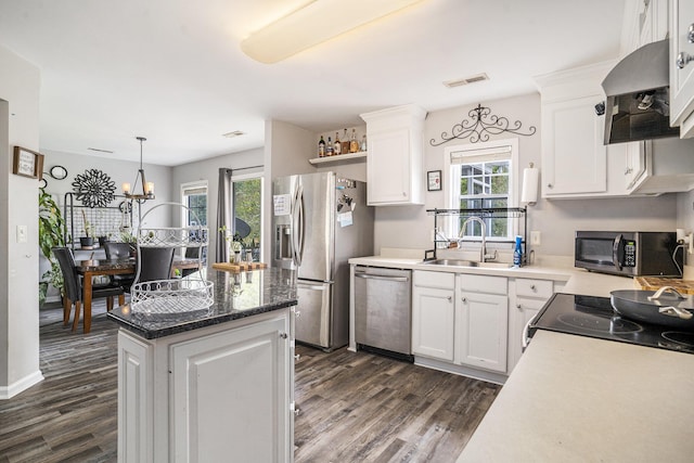 4987 Ballantine Dr, Summerville, SC 29485 - kitchen featuring stainless steel appliances, wall chimney range hood, a sink, and dark wood-style floors