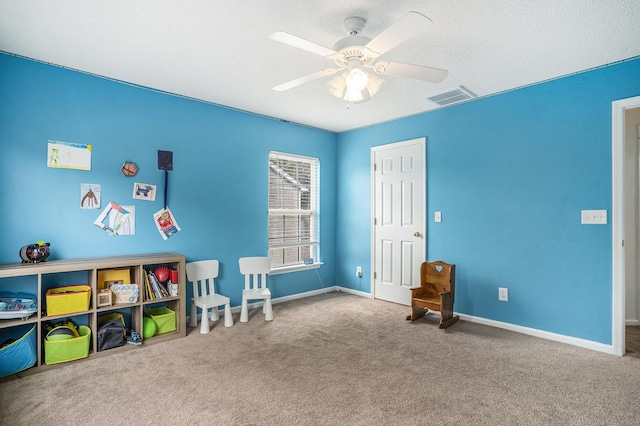 4987 Ballantine Dr, Summerville, SC 29485 - playroom featuring ceiling fan, carpet, baseboards, and a textured ceiling