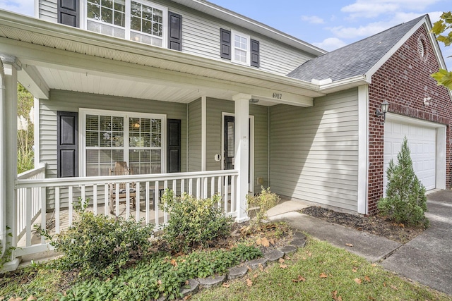 4987 Ballantine Dr, Summerville, SC 29485 - view of front facade featuring a porch, an attached garage, brick siding, and roof with shingles