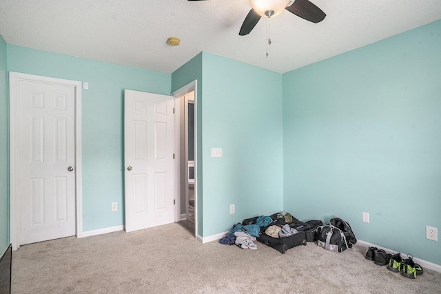 4987 Ballantine Dr, Summerville, SC 29485 - unfurnished bedroom with carpet, ceiling fan, baseboards, and a textured ceiling
