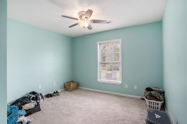 4987 Ballantine Dr, Summerville, SC 29485 - spare room featuring carpet flooring, ceiling fan, a textured ceiling, and baseboards