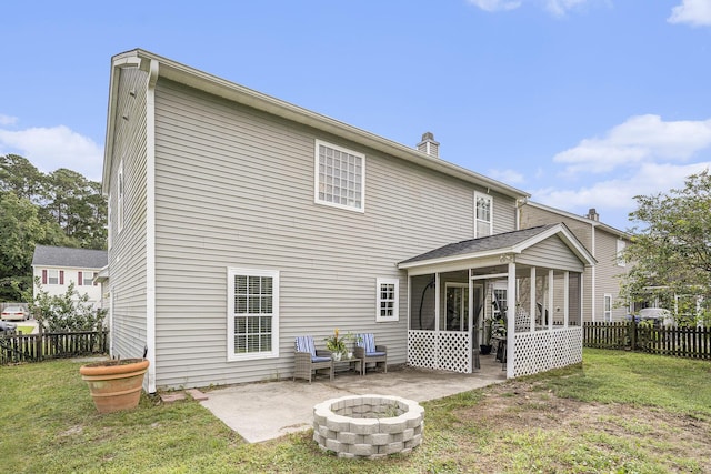 4987 Ballantine Dr, Summerville, SC 29485 - rear view of property featuring a sunroom, a patio, an outdoor fire pit, and a chimney