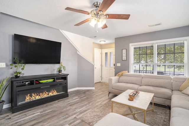 4987 Ballantine Dr, Summerville, SC 29485 - living room featuring a ceiling fan, wood finished floors, and baseboards