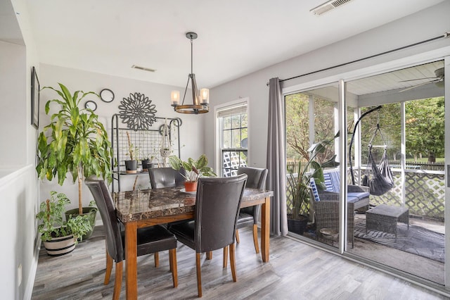 4987 Ballantine Dr, Summerville, SC 29485 - dining space with wood finished floors and a chandelier