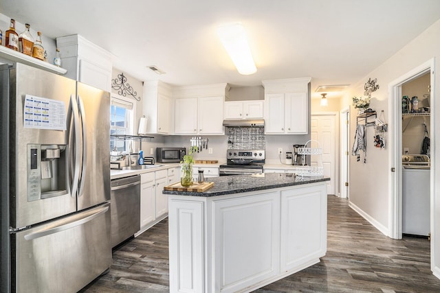 4987 Ballantine Dr, Summerville, SC 29485 - kitchen with stainless steel appliances, washer / clothes dryer, white cabinetry, and dark wood-style floors