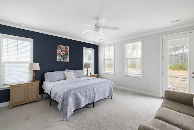 bedroom with multiple windows, crown molding, light carpet, and ceiling fan