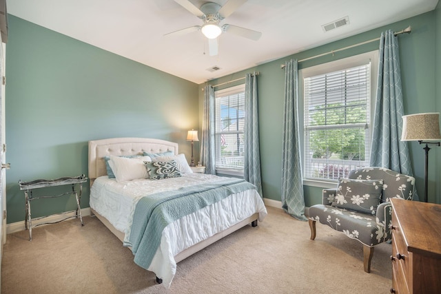 bedroom featuring carpet flooring, baseboards, visible vents, and ceiling fan