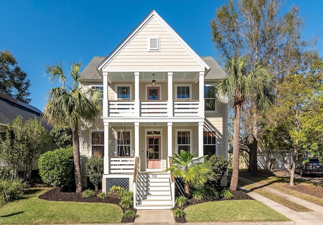 view of front of property featuring covered porch and a balcony