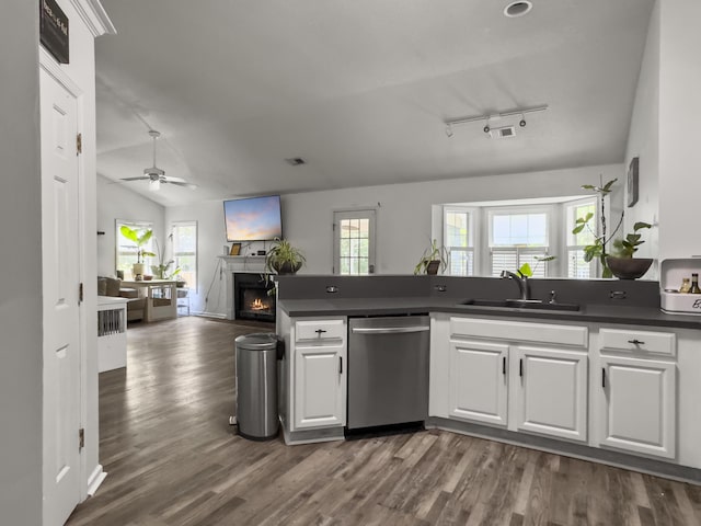 1317 Wild Olive Dr, Mount Pleasant, SC 29464 - kitchen with dishwasher, a sink, open floor plan, dark countertops, and white cabinets