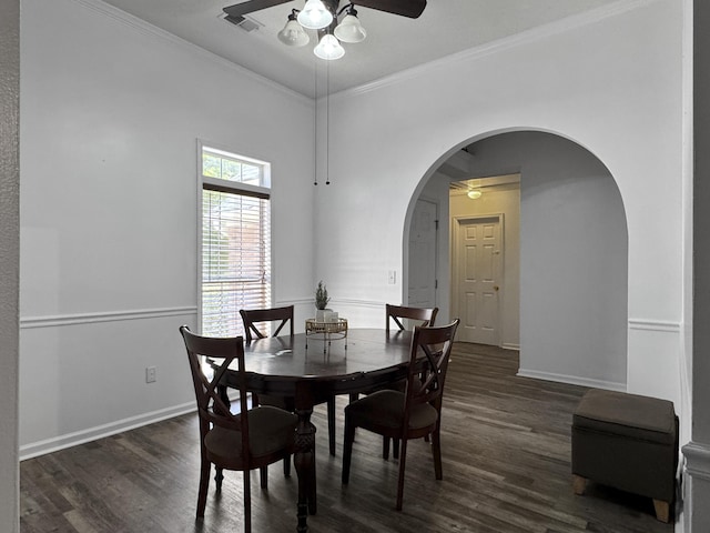 1317 Wild Olive Dr, Mount Pleasant, SC 29464 - dining room featuring ceiling fan, dark wood-style flooring, arched walkways, baseboards, and ornamental molding