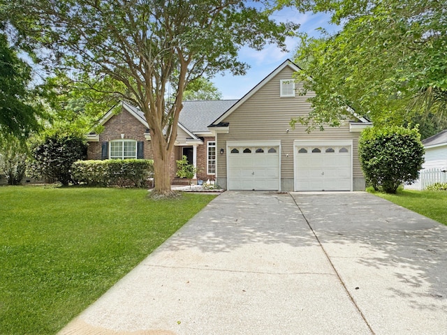 1317 Wild Olive Dr, Mount Pleasant, SC 29464 - traditional-style house with driveway, a garage, a front lawn, and brick siding