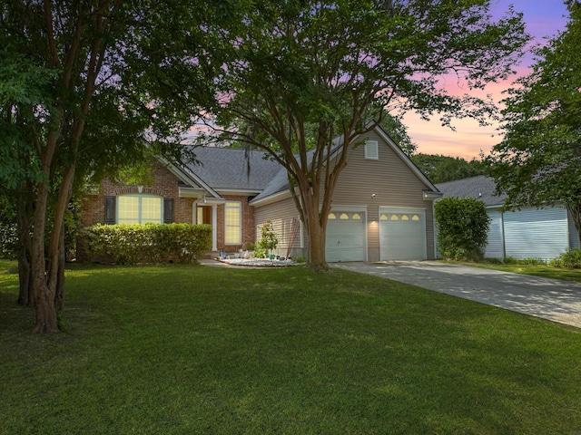 1317 Wild Olive Dr, Mount Pleasant, SC 29464 - view of front of property with a yard, concrete driveway, brick siding, and an attached garage