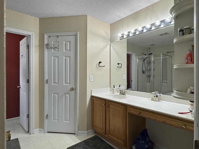 1317 Wild Olive Dr, Mount Pleasant, SC 29464 - full bathroom with a shower stall, vanity, a textured ceiling, and tile patterned flooring