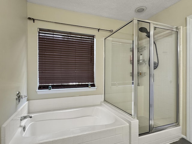 1317 Wild Olive Dr, Mount Pleasant, SC 29464 - full bath featuring a shower stall, a garden tub, and a textured ceiling