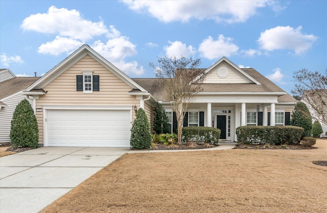 view of front of house featuring a garage and a porch