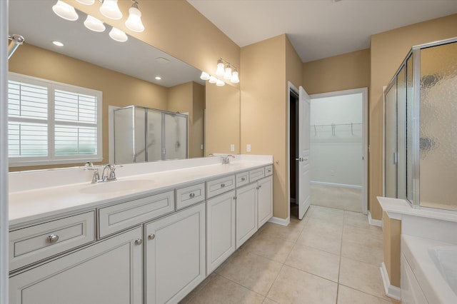 bathroom with walk in shower, tile patterned floors, and vanity