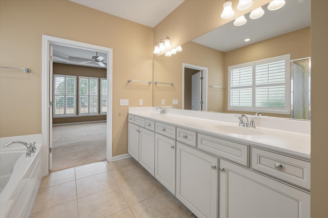 bathroom featuring vanity, a bathtub, tile patterned floors, and ceiling fan