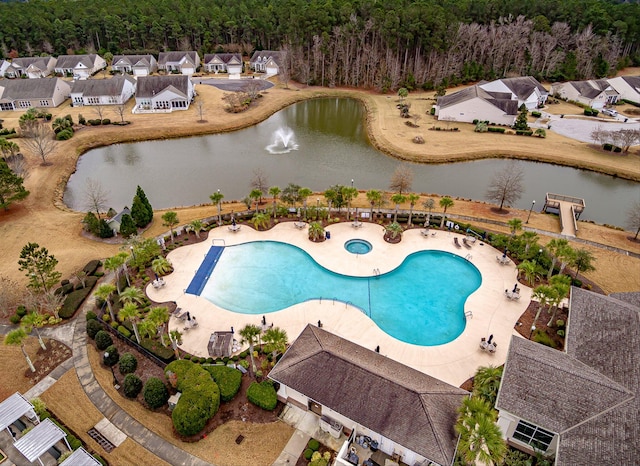 view of swimming pool featuring a water view