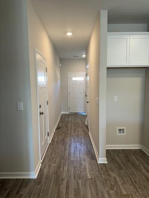 hallway featuring dark wood-type flooring