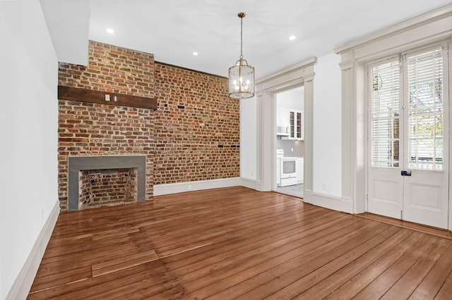 35 Society St Unit D, Charleston, SC 29401 - unfurnished dining area featuring baseboards, recessed lighting, wood finished floors, and a notable chandelier