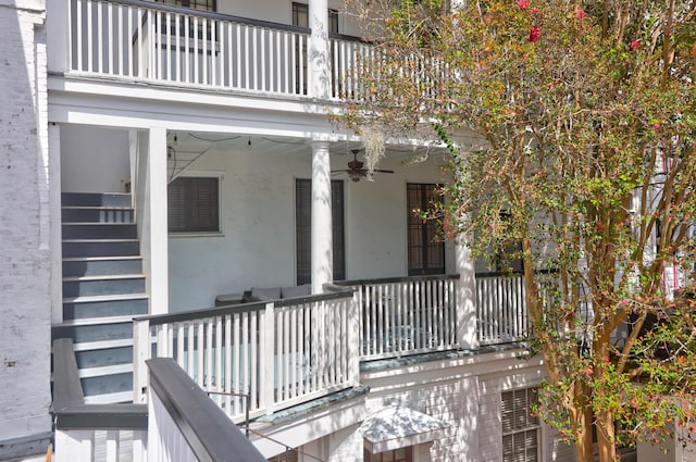 35 Society St Unit D, Charleston, SC 29401 - doorway to property with ceiling fan, stucco siding, and a balcony