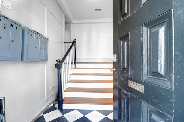 35 Society St Unit D, Charleston, SC 29401 - stairs featuring tile patterned floors, visible vents, ornamental molding, and mail area
