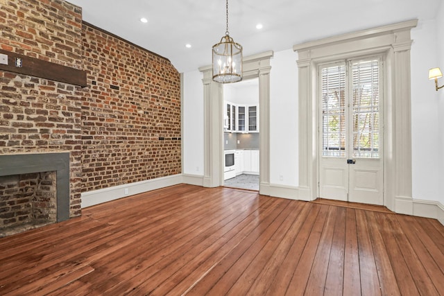 35 Society St Unit D, Charleston, SC 29401 - unfurnished dining area with baseboards, wood-type flooring, recessed lighting, and a chandelier
