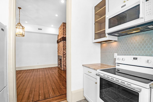 35 Society St Unit D, Charleston, SC 29401 - kitchen with light wood-style floors, white appliances, white cabinetry, baseboards, and backsplash
