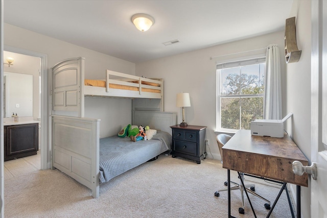 bedroom with visible vents and light carpet