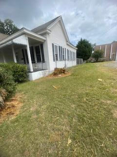 view of property exterior featuring a yard