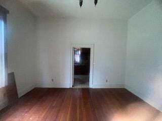 empty room featuring dark hardwood / wood-style floors