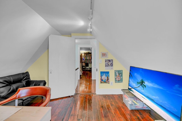 interior space with dark hardwood / wood-style floors and lofted ceiling